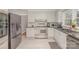 Updated kitchen with stainless steel appliances, white cabinets, and black granite countertops at 1201 Edgefield Ave, Gastonia, NC 28052
