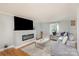 Modern living room with a sleek fireplace, a large TV, and comfortable seating at 1201 Edgefield Ave, Gastonia, NC 28052