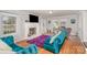 Cozy living room with hardwood floors, a fireplace, large windows, and stylish furnishings at 1201 Edgefield Ave, Gastonia, NC 28052