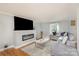Modern living room with a sleek fireplace, a large TV, and comfortable seating at 1201 Edgefield Ave, Gastonia, NC 28052