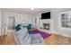Cozy living room with a fireplace, TV, and comfortable seating arrangement at 1201 Edgefield Ave, Gastonia, NC 28052