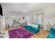 Bright living room with hardwood floors, a fireplace, large windows, and stylish furnishings at 1201 Edgefield Ave, Gastonia, NC 28052
