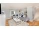 Bright living area with hardwood floors, a large sofa, and ample seating at 1201 Edgefield Ave, Gastonia, NC 28052