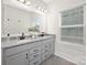 Bathroom featuring double sinks, granite countertops, and modern fixtures for a luxurious feel at 134 Montgomery Pl # 708, Mount Gilead, NC 27306