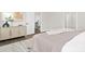 Bedroom with a light-colored bedspread, area rug, and modern decor at 134 Montgomery Pl # 708, Mount Gilead, NC 27306