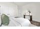 Bedroom with a minimalist design featuring double closets, elegant decor, and hardwood floors at 134 Montgomery Pl # 708, Mount Gilead, NC 27306