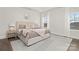 Bright bedroom with large windows, neutral colors, and stylish decor creating a relaxing space at 134 Montgomery Pl # 708, Mount Gilead, NC 27306