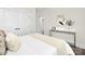Bedroom with a light-colored bedspread, neutral tones, art, and modern decor at 134 Montgomery Pl # 708, Mount Gilead, NC 27306
