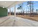 Covered patio with white columns overlooking backyard at 134 Montgomery Pl # 708, Mount Gilead, NC 27306