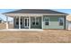A green modern home exterior featuring a covered back patio at 134 Montgomery Pl # 708, Mount Gilead, NC 27306