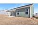 A green modern home exterior featuring a covered back patio at 134 Montgomery Pl # 708, Mount Gilead, NC 27306
