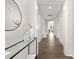 Hallway with hardwood floors, modern decor, and ample lighting creating a welcoming space at 134 Montgomery Pl # 708, Mount Gilead, NC 27306