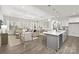 Spacious living area with modern décor, open to the kitchen and dining area, perfect for entertaining at 134 Montgomery Pl # 708, Mount Gilead, NC 27306