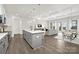 Bright, open-concept living space with a modern island, stainless appliances, and elegant flooring at 134 Montgomery Pl # 708, Mount Gilead, NC 27306