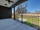 Inviting covered patio overlooking a spacious fenced backyard with lush green grass at 1467 Centennial Dr, Rock Hill, SC 29732