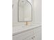 Modern bathroom with a black framed mirror, white cabinets, and gold fixtures at 1467 Centennial Dr, Rock Hill, SC 29732