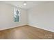Bright bedroom with hardwood floors, large window, and a ceiling fan at 1467 Centennial Dr, Rock Hill, SC 29732