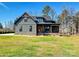 Charming home featuring a covered porch, brick accents, and a well-maintained yard at 1467 Centennial Dr, Rock Hill, SC 29732