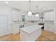 Beautiful kitchen with white cabinetry, modern pendants, stainless appliances, and a functional island at 1467 Centennial Dr, Rock Hill, SC 29732
