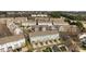 A high aerial view showcases the townhomes with private decks, garages, and driveways in a neighborhood at 15662 King Louis Ct, Charlotte, NC 28277
