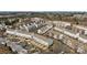 An elevated aerial shows townhomes with private decks and garages, in a well-maintained residential area at 15662 King Louis Ct, Charlotte, NC 28277