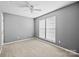 Bedroom featuring neutral colored walls, carpet, and window at 15662 King Louis Ct, Charlotte, NC 28277