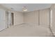 Large bedroom with a ceiling fan, neutral colors, and a doorway to the hallway at 15662 King Louis Ct, Charlotte, NC 28277