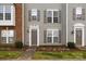 Townhome exterior featuring siding facade, neutral trim, and well-maintained landscaping at 15662 King Louis Ct, Charlotte, NC 28277