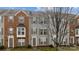 Townhome exterior featuring brick and siding facade, neutral trim, and well-maintained landscaping at 15662 King Louis Ct, Charlotte, NC 28277