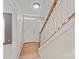 Home foyer with wood flooring and staircase at 15662 King Louis Ct, Charlotte, NC 28277