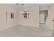Open floor plan dining and living room area with view into the kitchen at 15662 King Louis Ct, Charlotte, NC 28277