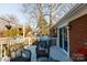 Relaxing back deck with grill, seating, and potted flowers creates an inviting outdoor living space at 1597 Mcgill St, Rock Hill, SC 29732
