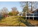 A huge backyard with a large deck, playset, privacy fence, and plenty of green space at 1597 Mcgill St, Rock Hill, SC 29732