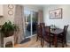 Cozy dining area next to sliding glass doors that let in natural light, hardwood floors, and dining table at 1597 Mcgill St, Rock Hill, SC 29732