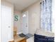 Inviting entryway with a view of the front door, a stylish macrame wall hanging and comfortable seating at 1597 Mcgill St, Rock Hill, SC 29732