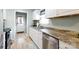 Kitchen showcasing a stainless steel dishwasher, countertops, and white cabinets at 1597 Mcgill St, Rock Hill, SC 29732