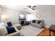 Cozy living room featuring a stone fireplace, hardwood floors, and neutral-toned furniture at 1597 Mcgill St, Rock Hill, SC 29732
