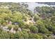 Stunning aerial view of the lakefront property surrounded by lush greenery and beautiful lake views at 16137 Tana Tea Cir, Tega Cay, SC 29708