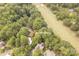 Overhead view of the property, surrounded by lush greenery and backing up to a golf course at 16137 Tana Tea Cir, Tega Cay, SC 29708