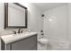 This bathroom features subway tile in the shower and dark fixtures for a classic contemporary look at 16137 Tana Tea Cir, Tega Cay, SC 29708