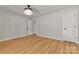 Bedroom features hardwood floors, overhead lighting, and a neutral decor at 16137 Tana Tea Cir, Tega Cay, SC 29708
