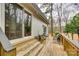 Cozy outdoor deck with comfortable seating, offering a serene space to relax and enjoy the beautiful surroundings at 16137 Tana Tea Cir, Tega Cay, SC 29708