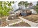 Charming single-story home with lush landscaping, beautiful flowers, and a spacious driveway at 16137 Tana Tea Cir, Tega Cay, SC 29708