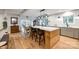 Spacious kitchen with a large island, quartz countertops, and seating for three at 16137 Tana Tea Cir, Tega Cay, SC 29708