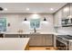 Updated kitchen with subway tile backsplash, stainless steel appliances, and gray cabinetry at 16137 Tana Tea Cir, Tega Cay, SC 29708