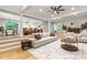 Bright living room with hardwood floors, neutral decor, open to kitchen and dining areas at 16137 Tana Tea Cir, Tega Cay, SC 29708