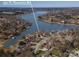 Aerial view of waterfront property with a private dock, lush landscaping, and lake views near 170 W Maranta Rd at 170 W Maranta Rd, Mooresville, NC 28117