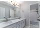 Beautiful bathroom featuring a double sink vanity, decorative tile, and a separate shower area at 170 W Maranta Rd, Mooresville, NC 28117