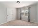 Comfortable bedroom with a window view and ample closet space, perfect for relaxation and storage at 170 W Maranta Rd, Mooresville, NC 28117