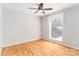 Bedroom features hardwood floors, ceiling fan, and natural light at 170 W Maranta Rd, Mooresville, NC 28117